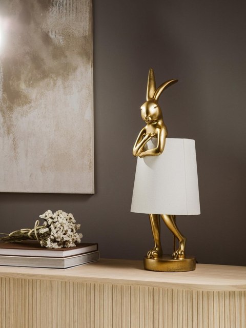 Kare Design KARE lampa stołowa RABBIT złota / biała - lampka złoty króliczek i biały klosz, wykonana z polirezyny lakierowanej Kare Design KARE lampa stołowa RABBIT złota / biała - lampka złoty króliczek i biały klosz, wykonana z polirezyny lakierowanej